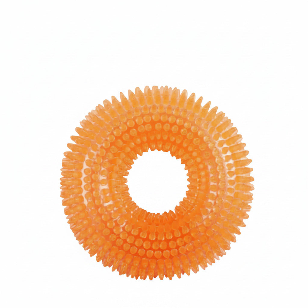 Orange squeaky dog ball toy with raised nubs and outer spikes ring