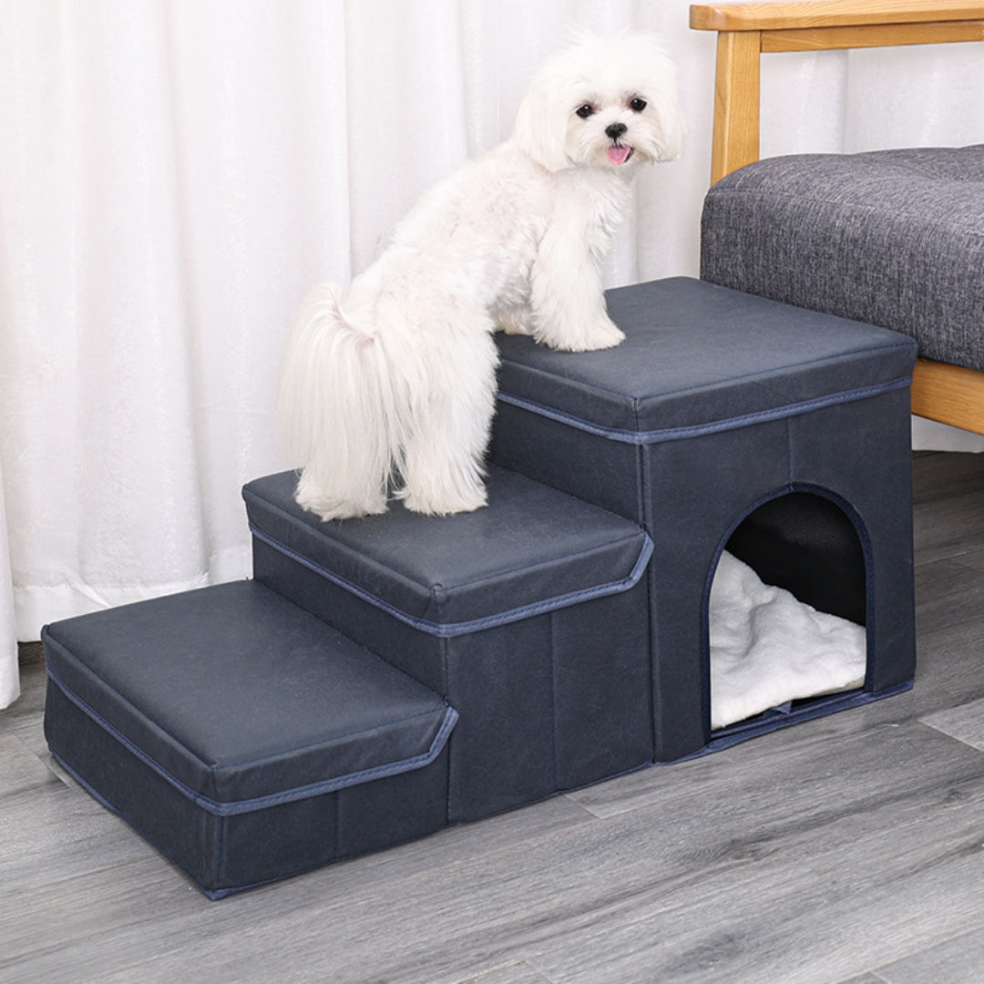 Dark blue padded dog stairs with three steps and an enclosed lower bed