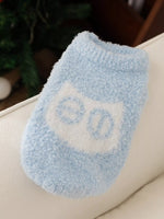 Light blue knitted pet sweater with large light-blue lettering graphic