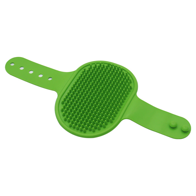 Green silicone pet grooming brush with raised rubber massage bristles