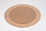 Tan round pet mat with quilted hex pattern, stitched edge