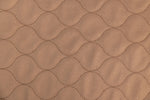 Tan pet mat fabric with quilted hex pattern texture