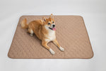 Tan quilted hex pet mat with rounded stitched border