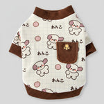White fleece sweatshirt with brown ribbed trim and allover dog print