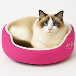Donut pet bed with cream plush nest and pink outer, paw print patch