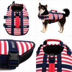 Red, white, and navy striped dog life jacket with safety handle and buckles