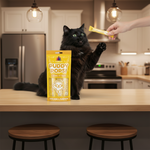 Lickable chicken & pumpkin cat treat pouch with cat reaching for one stick