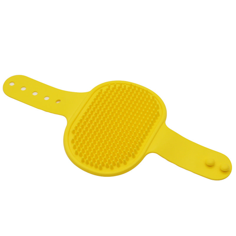 Yellow silicone pet grooming brush with raised rubber massage bristles