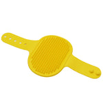 Yellow silicone pet grooming brush with raised rubber massage bristles