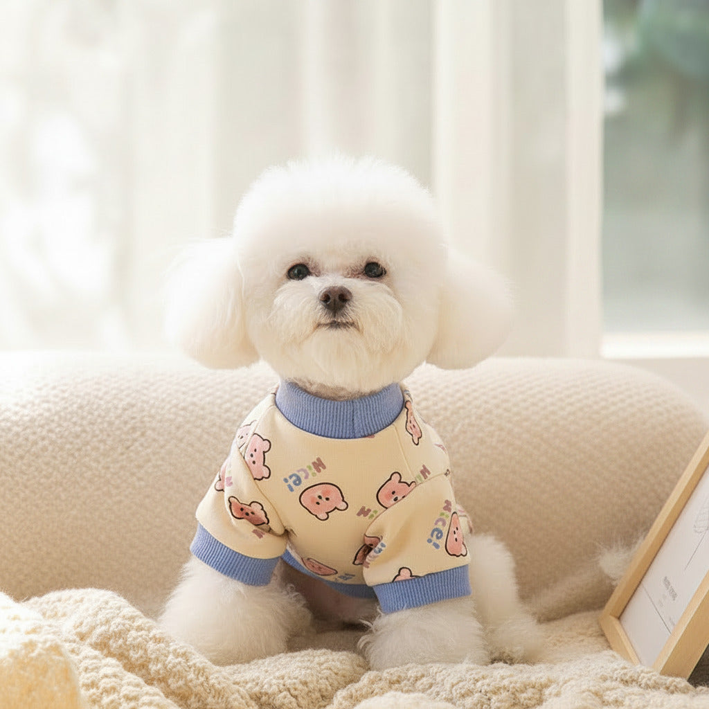 Cream fleece sweatshirt with blue ribbed collar and cuffs; cute dog print