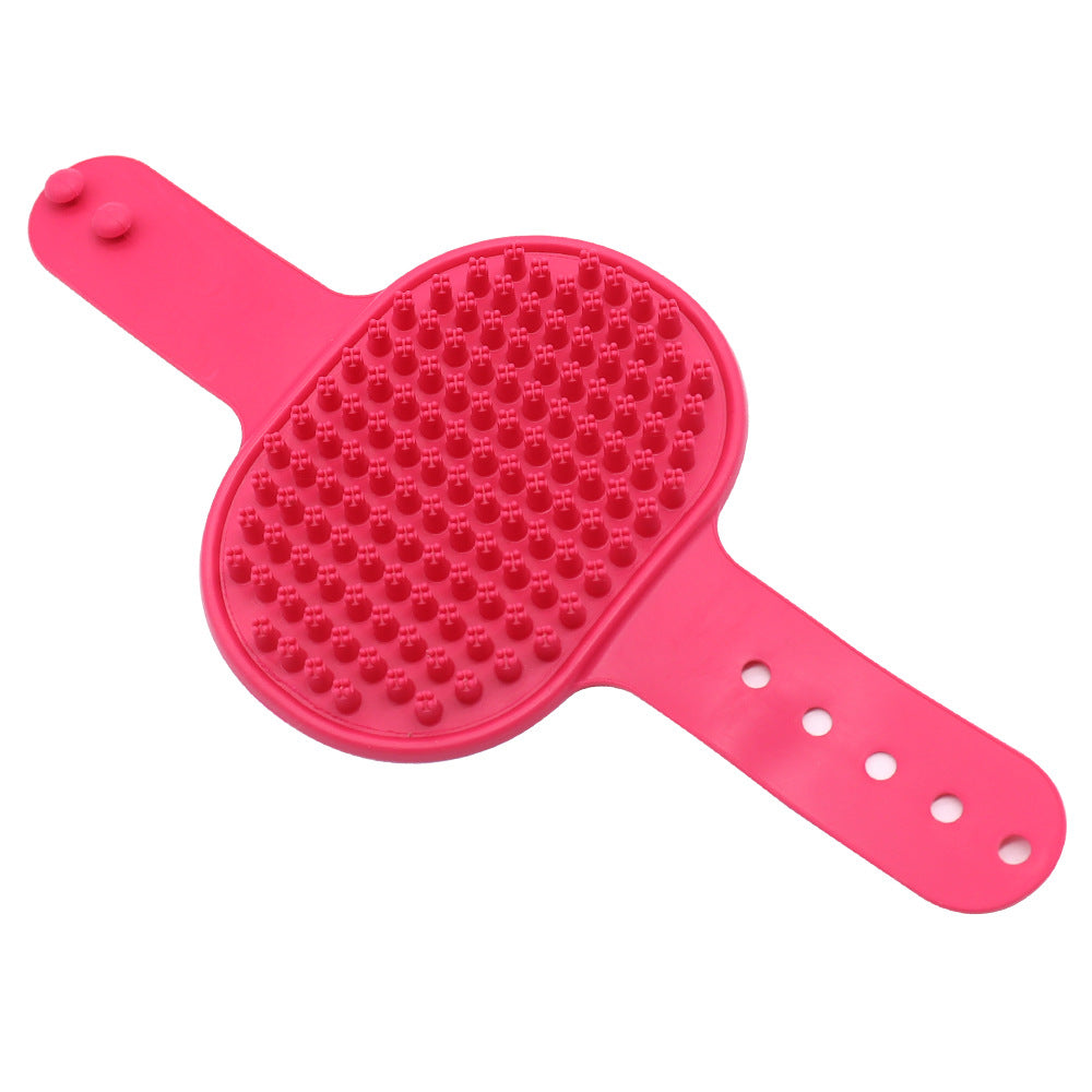 Pink silicone pet grooming brush with massage nubs and wrist holes