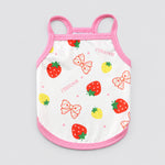 White pet tank top with pink trim, scattered strawberry and bow fruit print design on front.