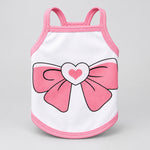 White pet tank top with pink trim, large pink bow graphic and heart detail on front.