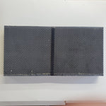 Two dark plastic foundation panels with dense hexagonal pattern