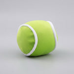 Plush squeaky lime-green dog ball toy with white trim and seams