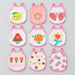 Set of pet tank tops with pink trim, featuring various fruit and bow prints (front view).