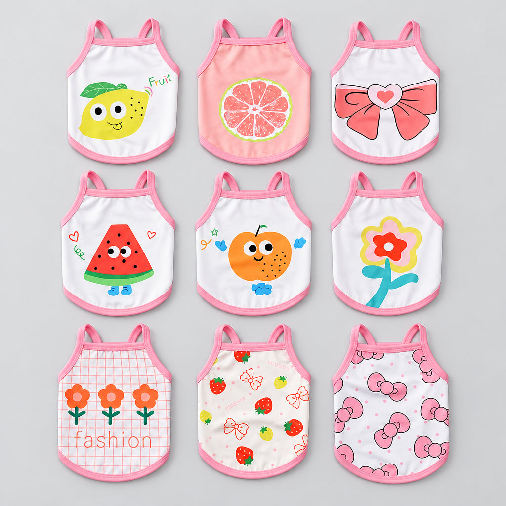 Set of pet tank tops with pink trim, featuring various fruit and bow prints (front view).