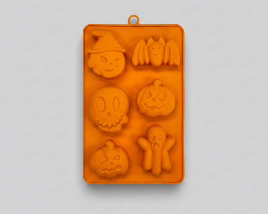 Orange silicone pet treat mold with multiple Halloween animal and pumpkin shapes.