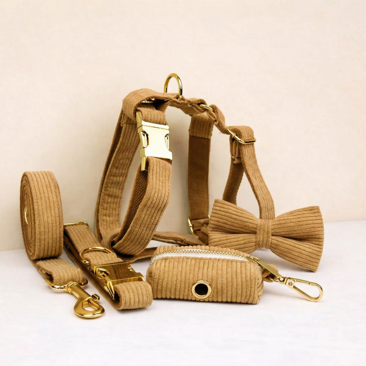 Caramel corduroy dog set with collar, leash, harness, bowtie, and poop bag holder