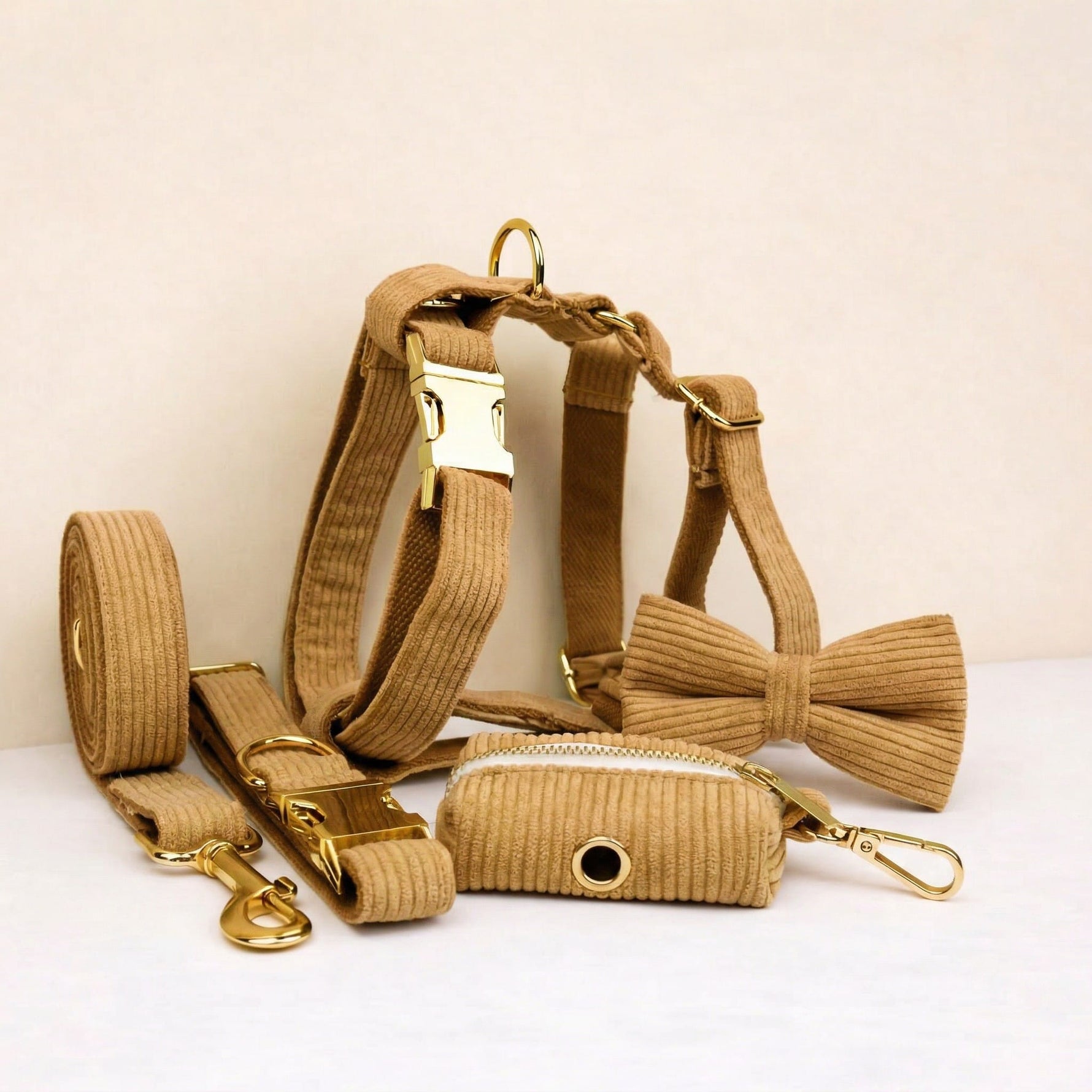 Caramel corduroy dog set with collar, leash, harness, bowtie, and poop bag holder