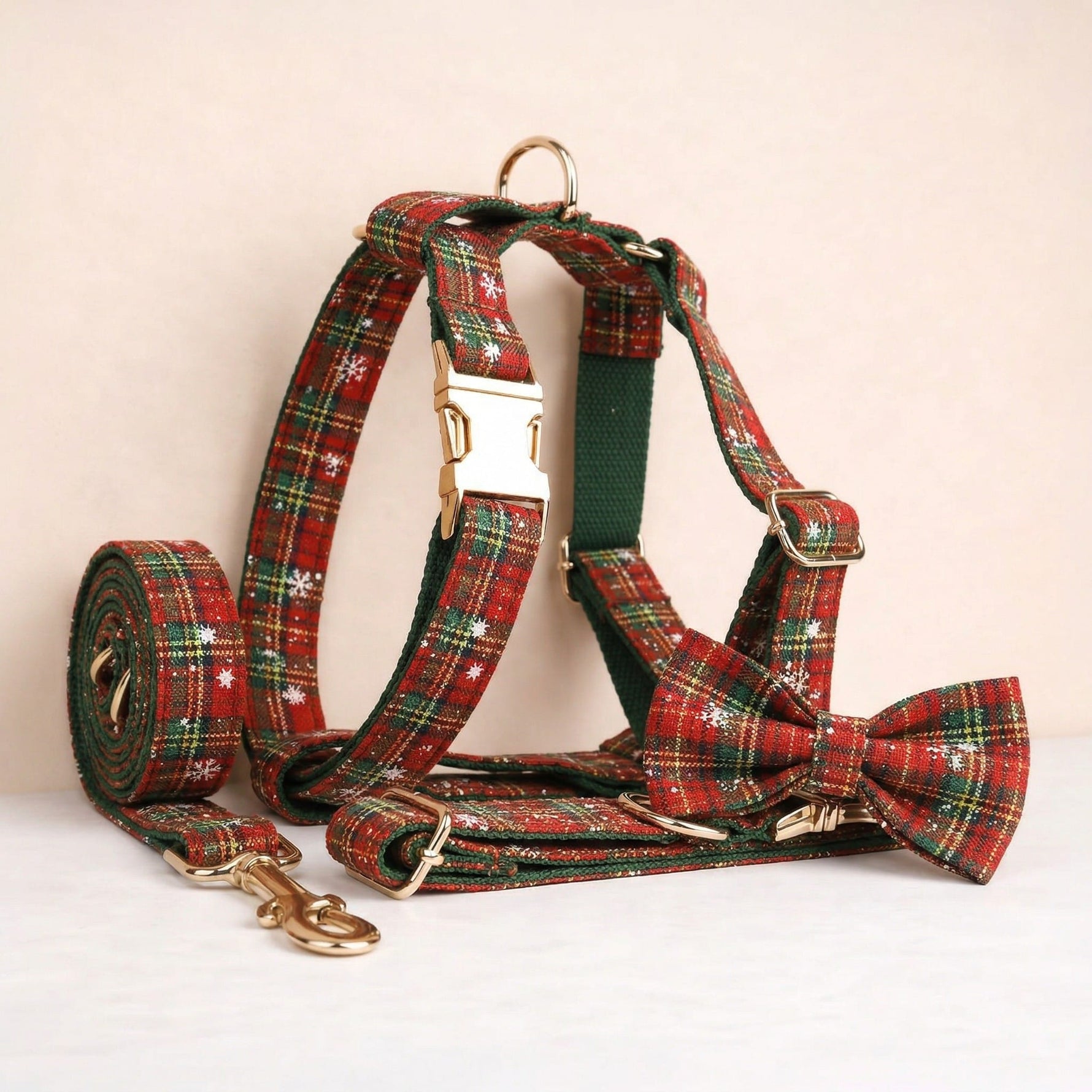 Red and green plaid dog harness set with matching bowtie, collar and leash