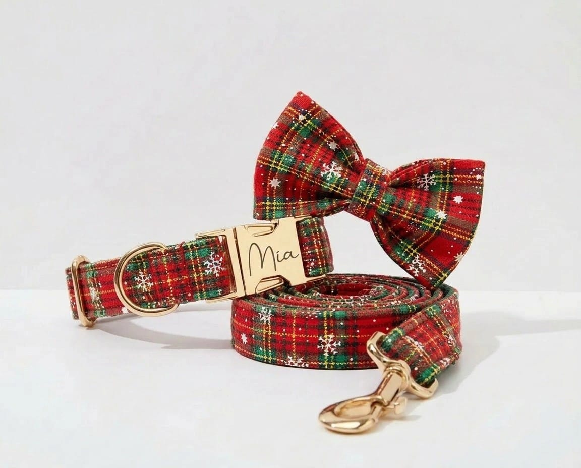 Red and green plaid dog collar, bowtie, harness and leash set on display