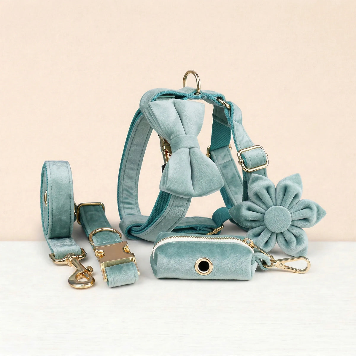 Teal velvet pet collar set with leash, harness, bowtie, flower detail, and poop bag holder