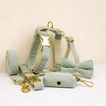 Light green corduroy dog harness set with collar, leash, bowtie, and poop bag holder