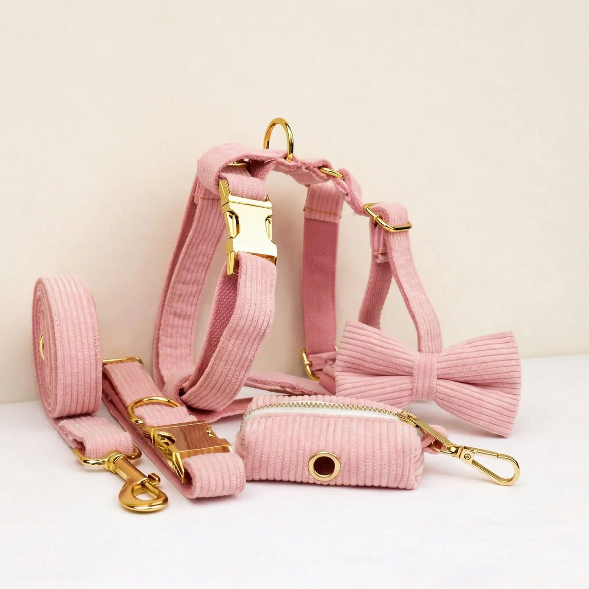 Pink corduroy dog collar, leash, harness, and bowtie set with gold hardware