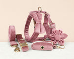 Pink velvet dog harness set with leash, collar, fabric bow, and flower accent