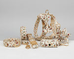 Dog accessory set with ivory floral collar, harness, leash, bowtie, flower, and poop bag holder