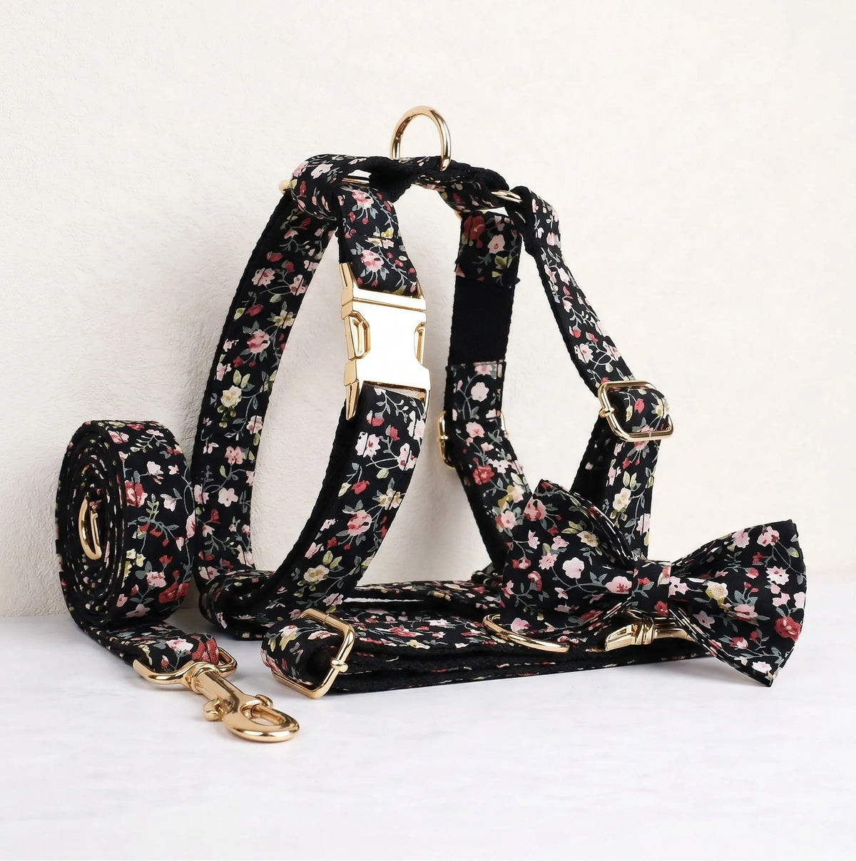 Floral dog collar, leash and bowtie set in black with pink blossoms and gold hardware