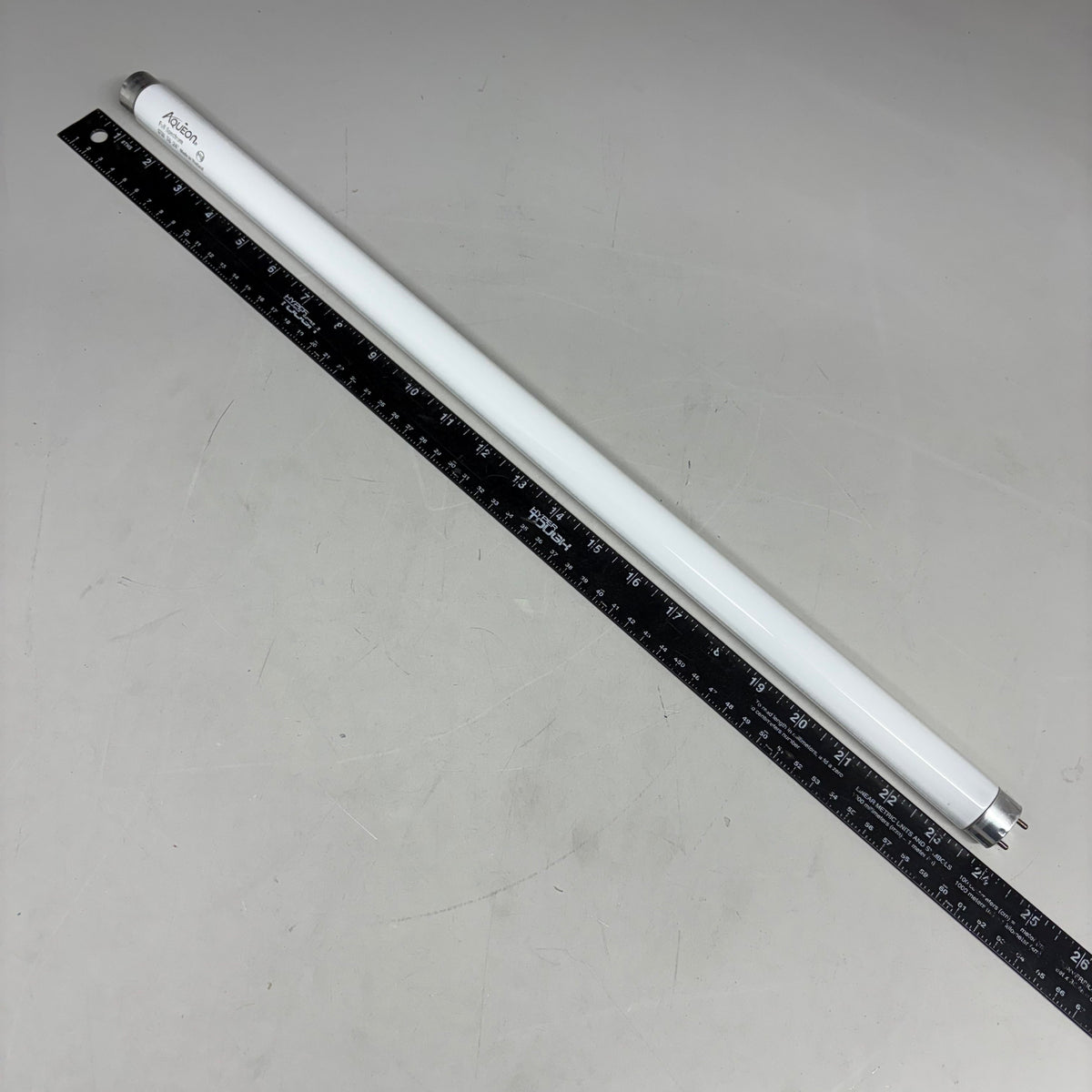 Aqueon T8 aquarium lamp, white tube with black measurement scale