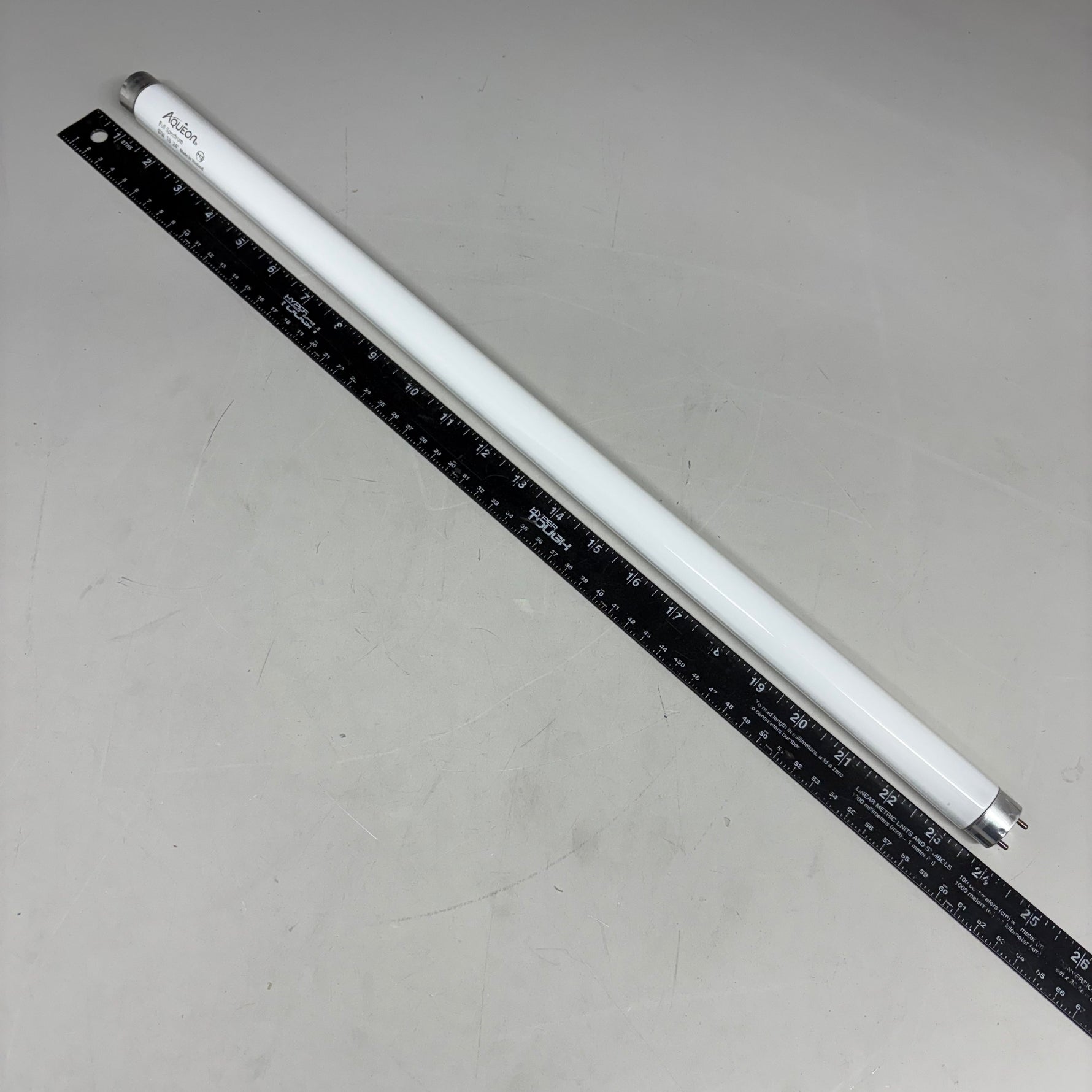 Aqueon T8 aquarium lamp, white tube with black measurement scale