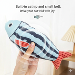 Blue and black striped catnip fish plush with built-in bell; held in hand