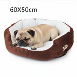 60x50cm brown round pet bed with white plush liner and paw emblem, dog sleeping inside