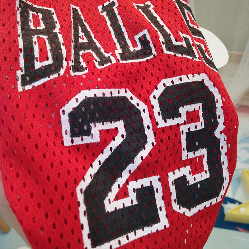 Red mesh basketball pet jersey with black “BALLS 23” print and striped collar cuffs