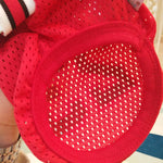 Close-up of red mesh basketball jersey fabric and circular back design panel