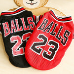 Red and black mesh basketball pet jerseys with large “BALLS 23” number print