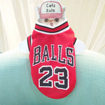 Red mesh basketball pet jersey with “BALLS 23” lettering and striped ribbed collar