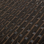 Dark rattan wicker weave pattern on pet bed frame