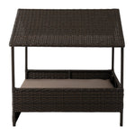 Cabana-style raised pet bed with dark brown woven wicker and beige cushion