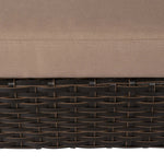 Close-up of beige cushion on dark brown woven wicker raised pet bed