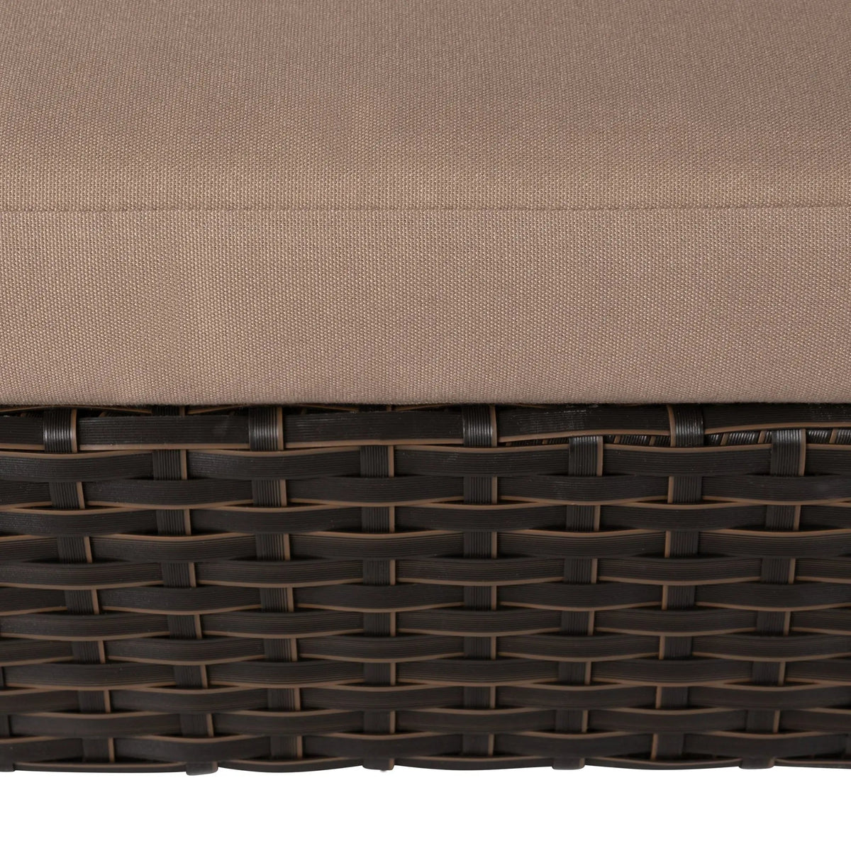 Close-up of beige cushion on dark brown woven wicker raised pet bed