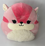 Large pink and cream plush animal face with closed eyes and soft fuzzy belly