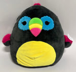 Large black plush bird with blue wings, green and pink beak, and yellow belly