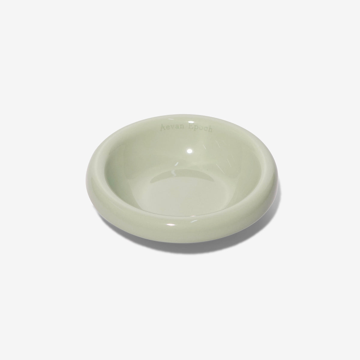 Stoneware pet bowl, glossy light sage green, shallow round dish with raised rim