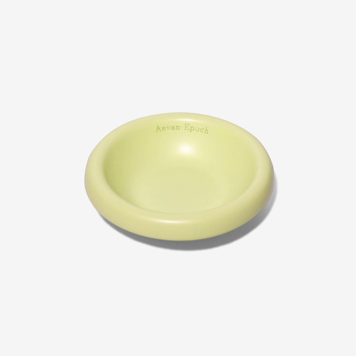 Stoneware pet bowl, glossy pale yellow-green, shallow round dish with raised rim