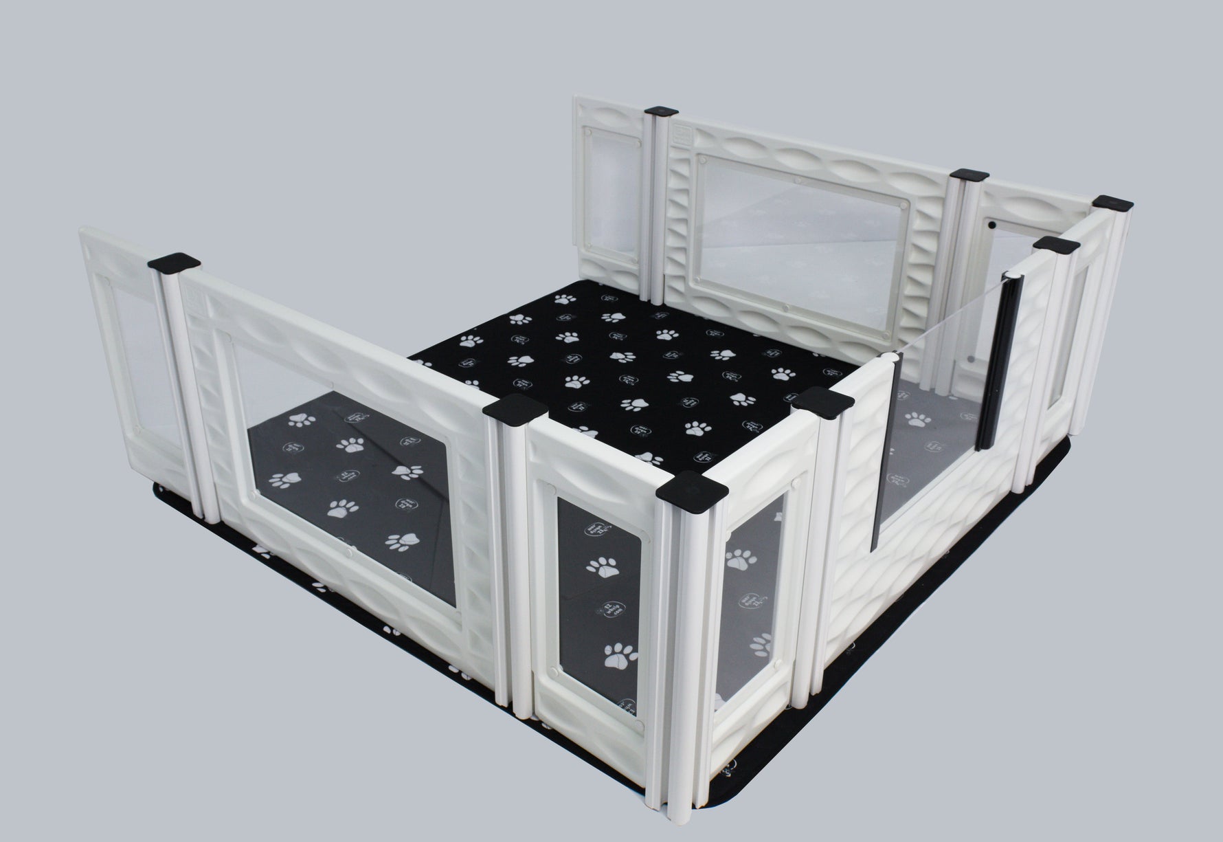 Windowed add-on room with white frame and black paw-print floor mat