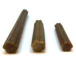 Three brown pet chew sticks, grainy texture